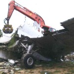 Another view of our excavator on top of this doomed airplane