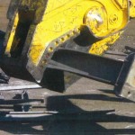 Shear attachment on excavator with a 1200 ton cutting force processes large pieces of steel recovered from
demolition for easy and productive removal from site.